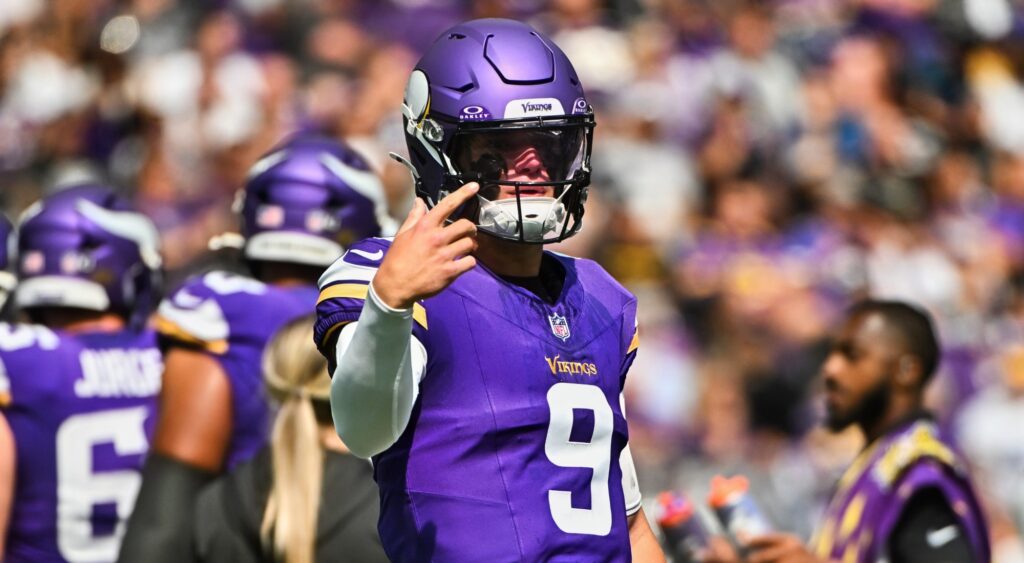 JJ McCarthy of Minnesota Vikings looking on.