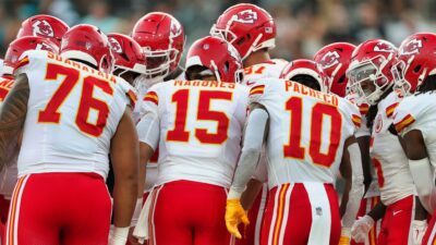 Kansas City Chiefs players in huddle