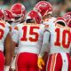 Kansas City Chiefs players in huddle