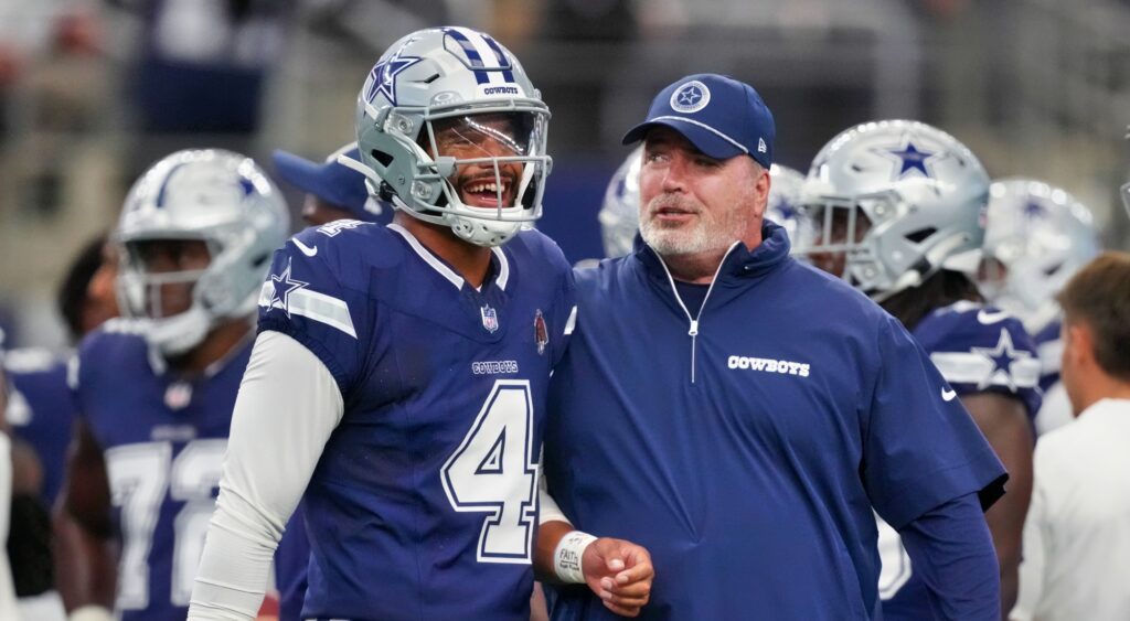 Dak Prescott and Mike McCarthy of Dallas Cowboys talking at game.