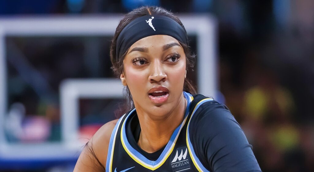 Angel Reese of Chicago Sky looking on.