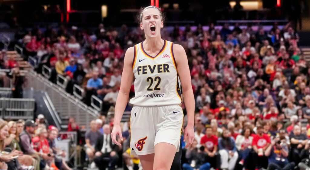 Caitlin Clark yells on the court.