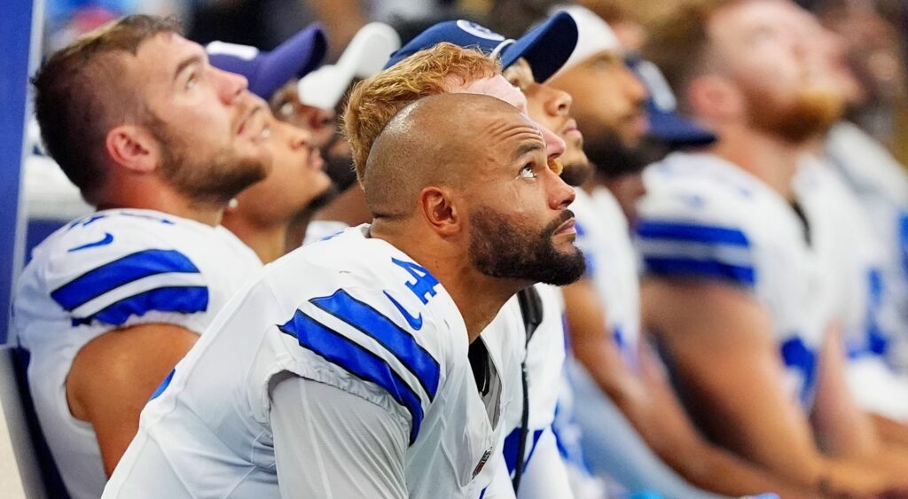 Dak Prescott of Dallas Cowboys looking on.