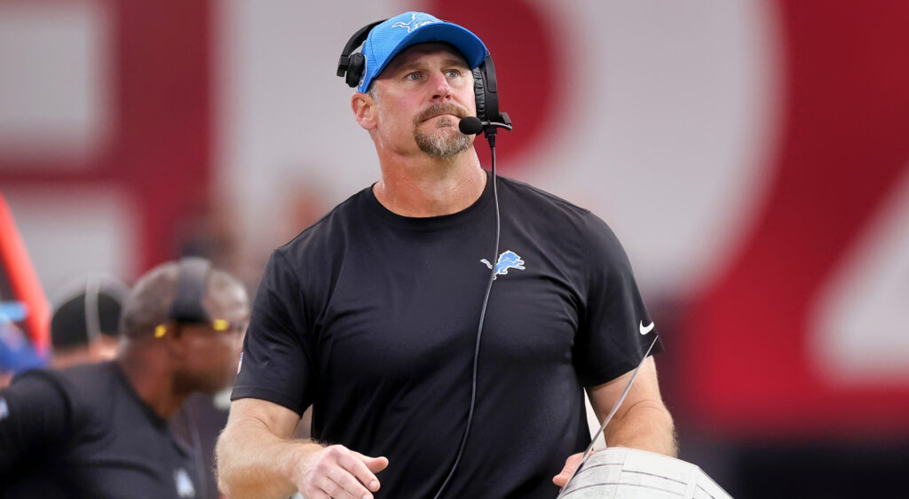 Dan Campbell wearing cap and headset