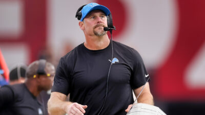 Dan Campbell wearing cap and headset