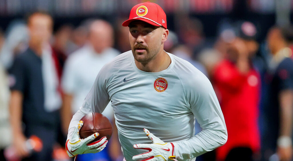 Travis Kelce holding a football