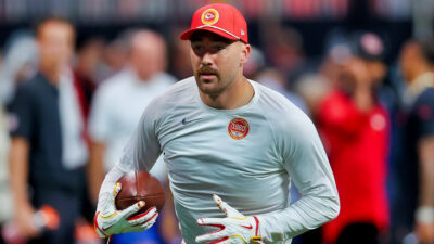 Travis Kelce holding a football