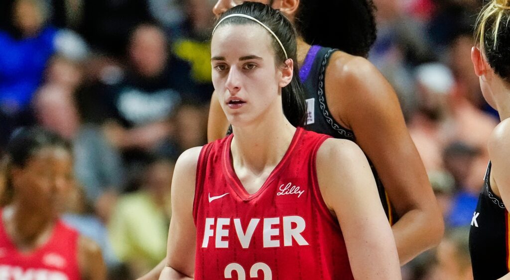 Caitlin Clark playing basketball