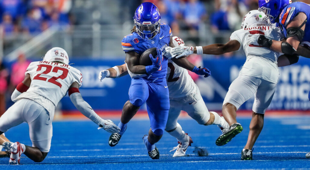 Ashton Jeanty running with a football