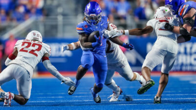 Ashton Jeanty running with a football