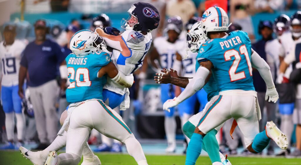 Titans tight end Josh Whyle goes up to make a catch against the Dolphins.