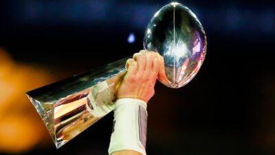 Photo of Lombardi Trophy being raised for article on Patrick Pass