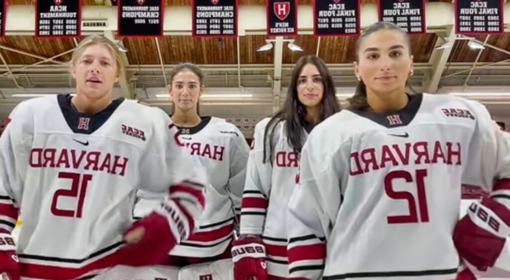 Harvard women's hockey players doing a dance.