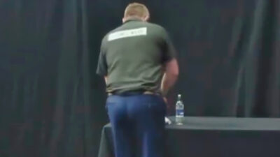 James Wade standing near a table