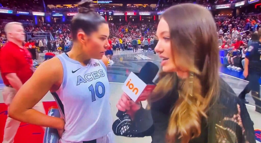 Kelsey Plum doing an on court interview.