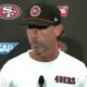 Kyle Shanahan speaking to reporters