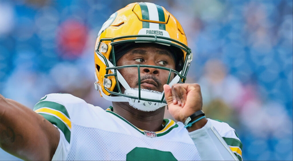 Quarterback Malik Willis of the Packers warms up against the Titans.