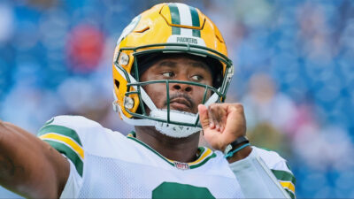 Quarterback Malik Willis of the Packers warms up against the Titans.