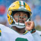 Quarterback Malik Willis of the Packers warms up against the Titans.