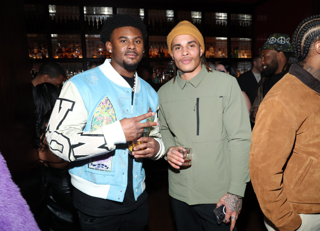 Malik Willis and Kenny Stills at party