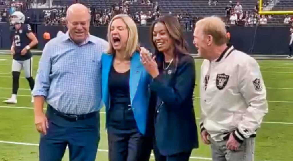 Mark Davis and David Tepper on the field together before their game.