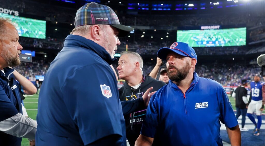 Brian Daboll head coach of the Giants shakes hands with Mike McCarthy head coach of the Cowboys.