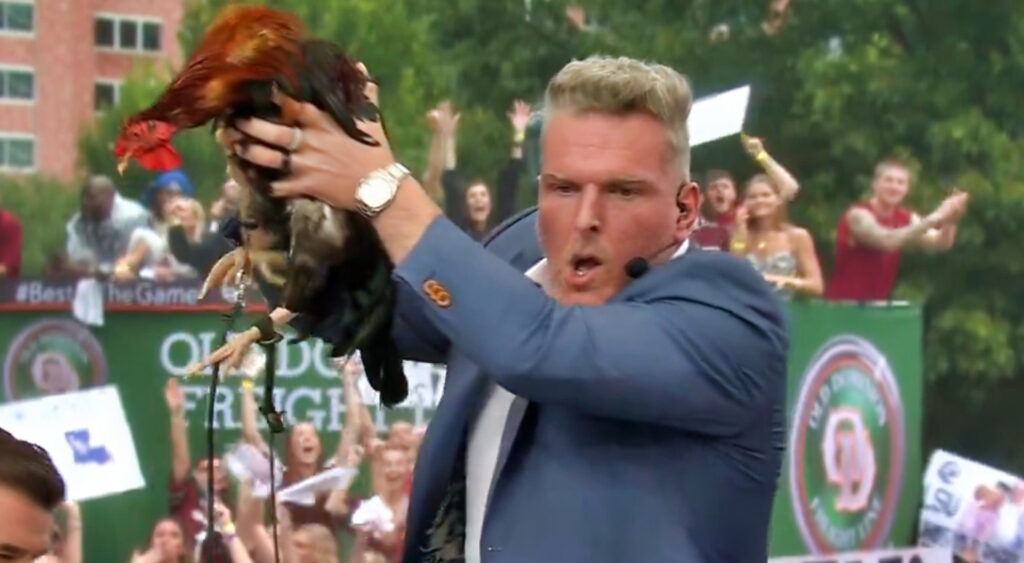 Pat McAfee holding a rooster