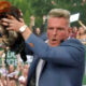 Pat McAfee holding a rooster