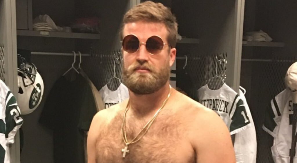 Shirtless Ryan Fitzpatrick wearing sunglasses