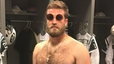 Shirtless Ryan Fitzpatrick wearing sunglasses