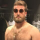 Shirtless Ryan Fitzpatrick wearing sunglasses