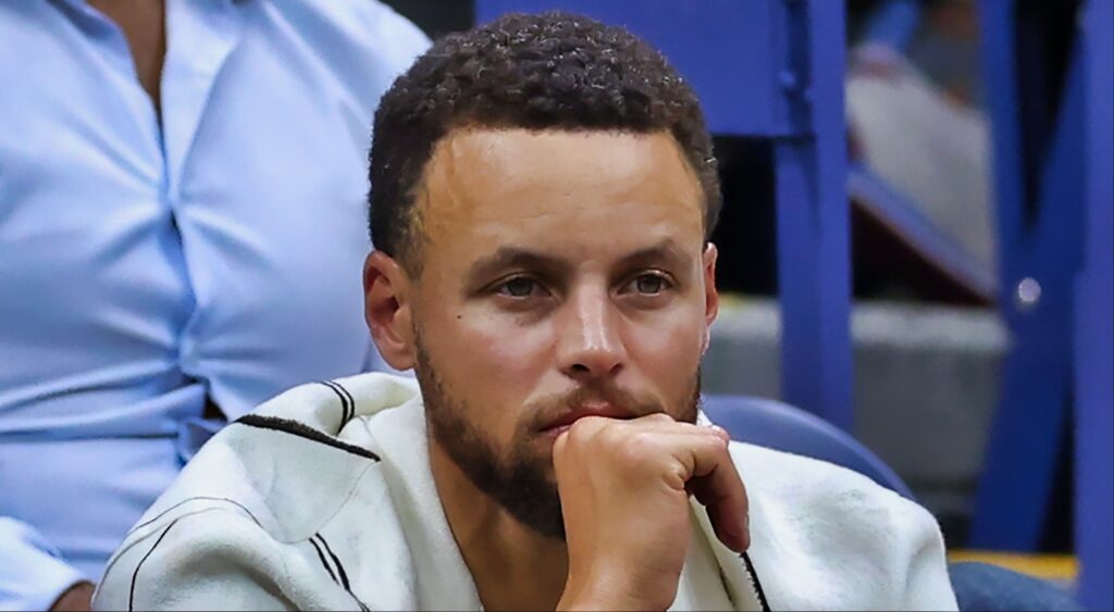 Stephen Curry looks closely.