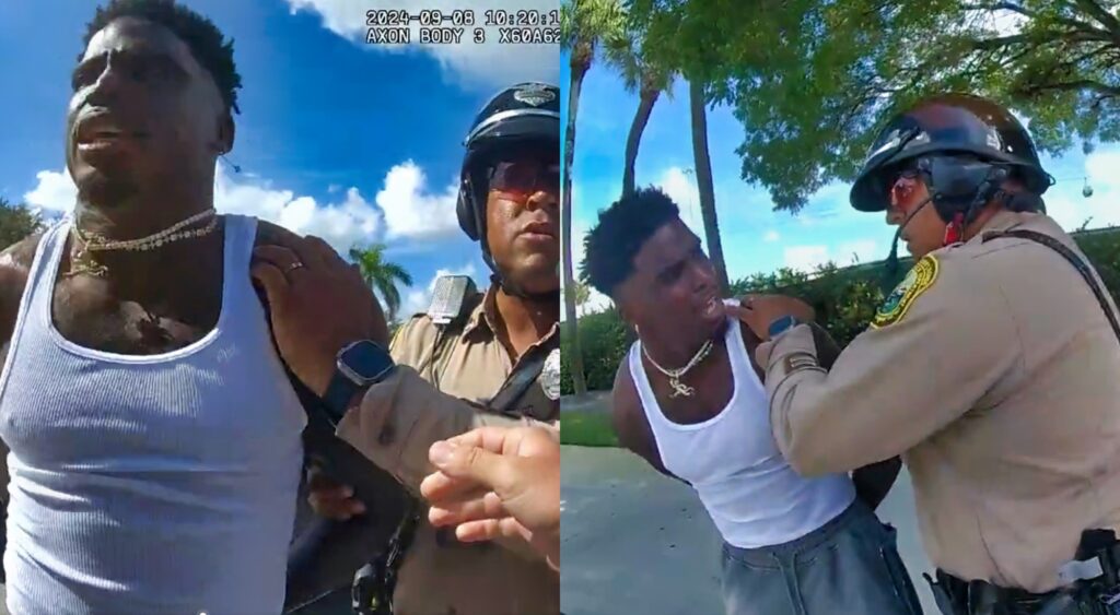 Tyreek Hill being arrested by Miami Police officers.