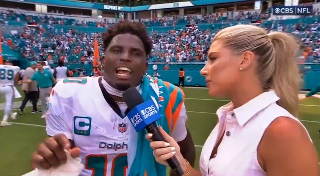 Tyreek Hill giving an on-field postgame interview.