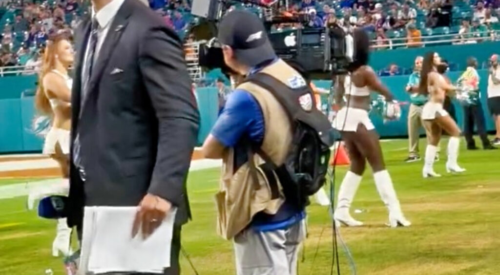 Miami Dolphins cheerleaders jumping in air