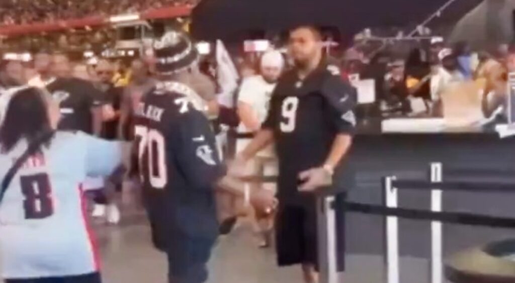 Atlanta Falcons fans arguing before beginning a brawl at game.