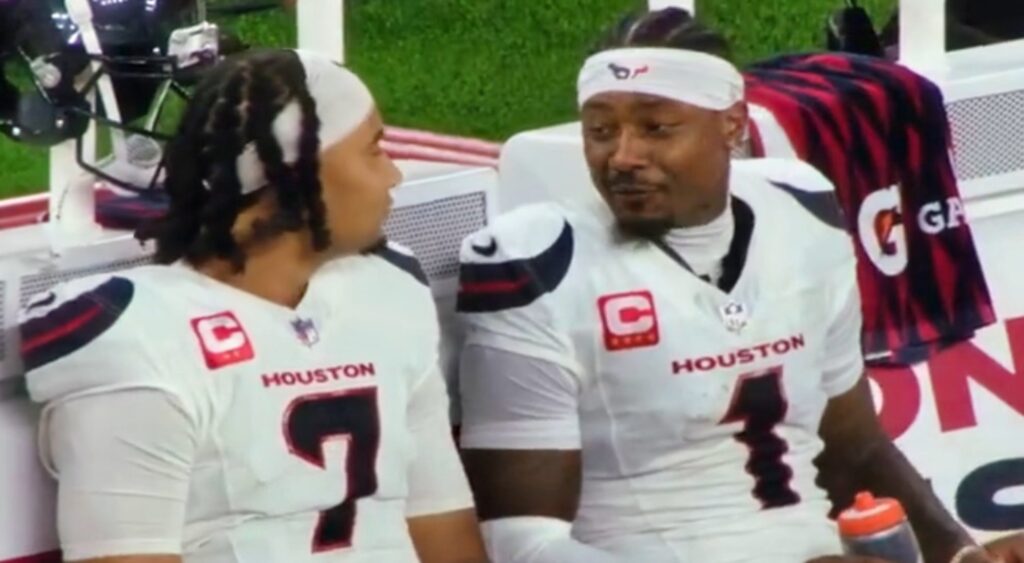 CJ Stroud and Stefon Diggs talking on sidelines during Houston Texans-Chicago Bears game.