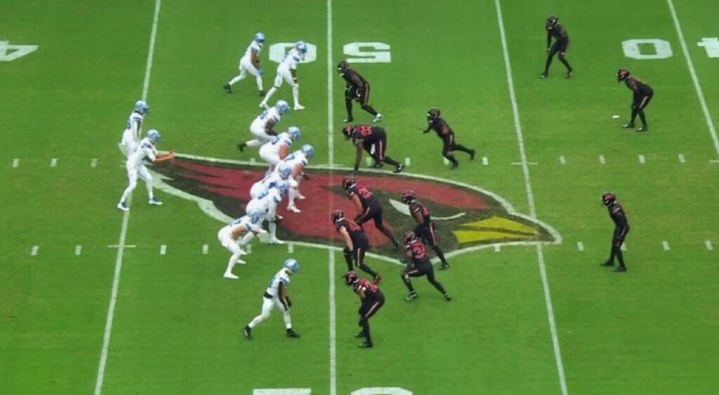 Detroit Lions running a play vs. Arizona Cardinals. The fans are ripping the NFL refs for a missed game-changing call.