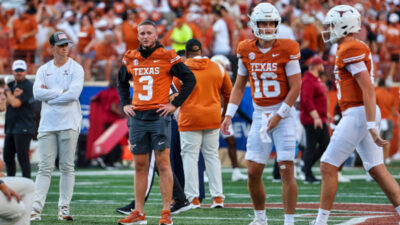 Quinn Ewers standing next to Arch Manning