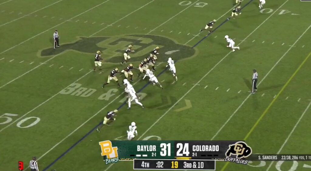 Shedeur Sanders of Colorado Buffaloes preparing a Hail Mary throw vs. Baylor.