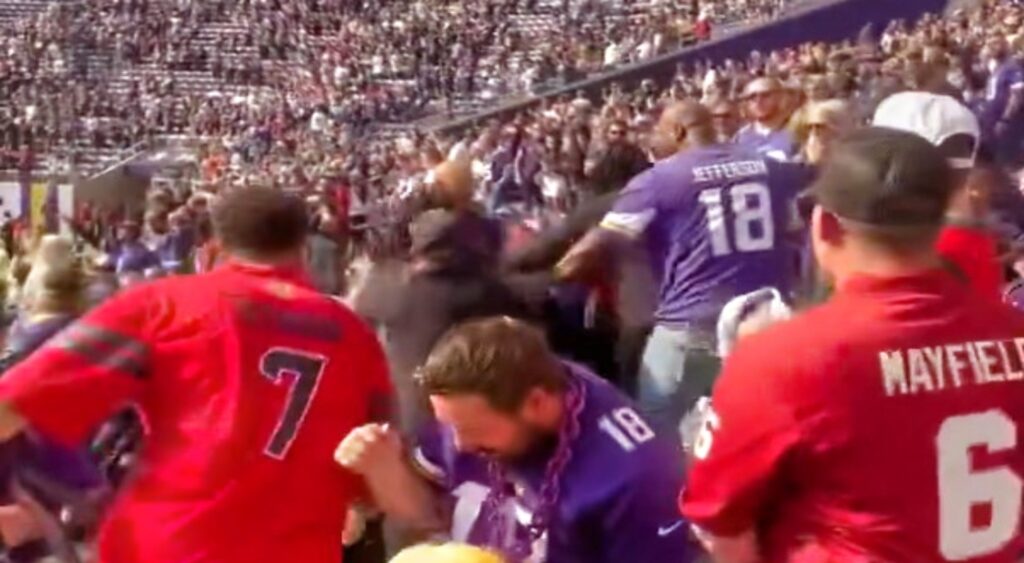 Minnesota Vikings and Houston Texans fans fighting at game.