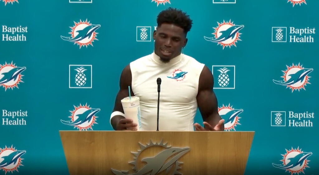 Tyreek Hill speaks at a press conference.