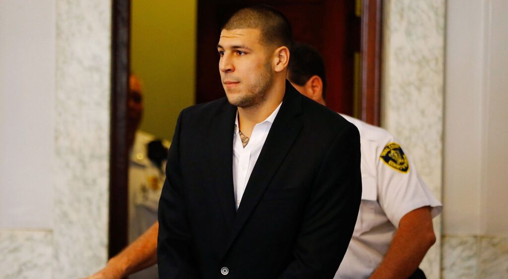 Aaron Hernandez being escorted into the courtroom of the Attleboro District Court for his hearing on August 22, 2013