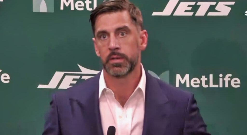 Aaron Rodgers speaking to reporters