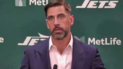 Aaron Rodgers speaking to reporters