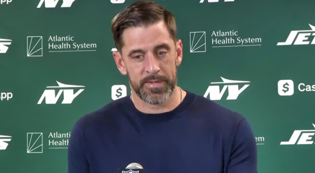 Aaron Rodgers speaking to reporters