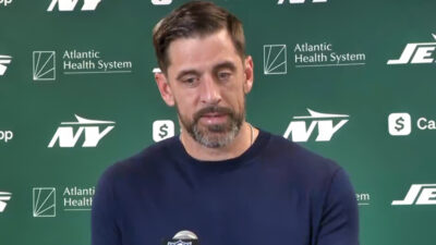 Aaron Rodgers speaking to reporters