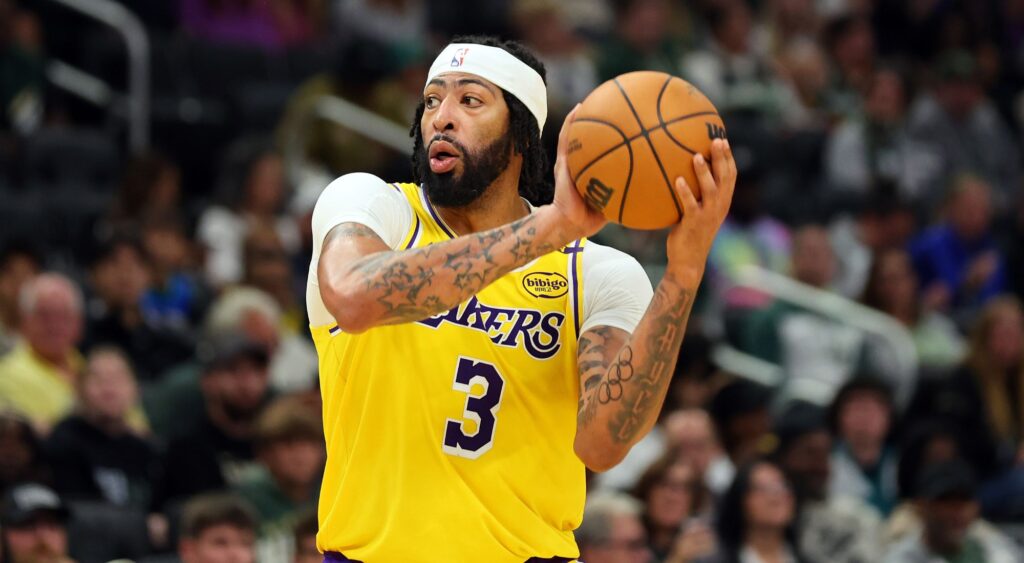 Anthony Davis of the Los Angeles Lakers handles the ball during a preseason game against the Milwaukee Bucks at Fiserv Forum on October 10, 2024