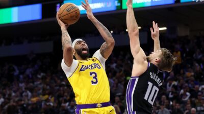 Anthony Davis of the Los Angeles Lakers goes up for a shot on Domantas Sabonis of the Sacramento Kings