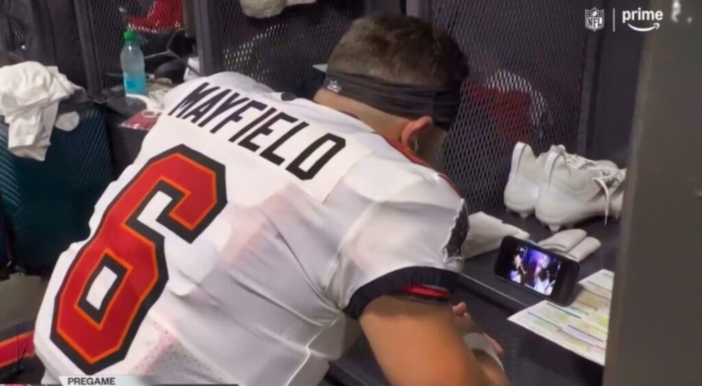 Baker Mayfield watching video on his phone